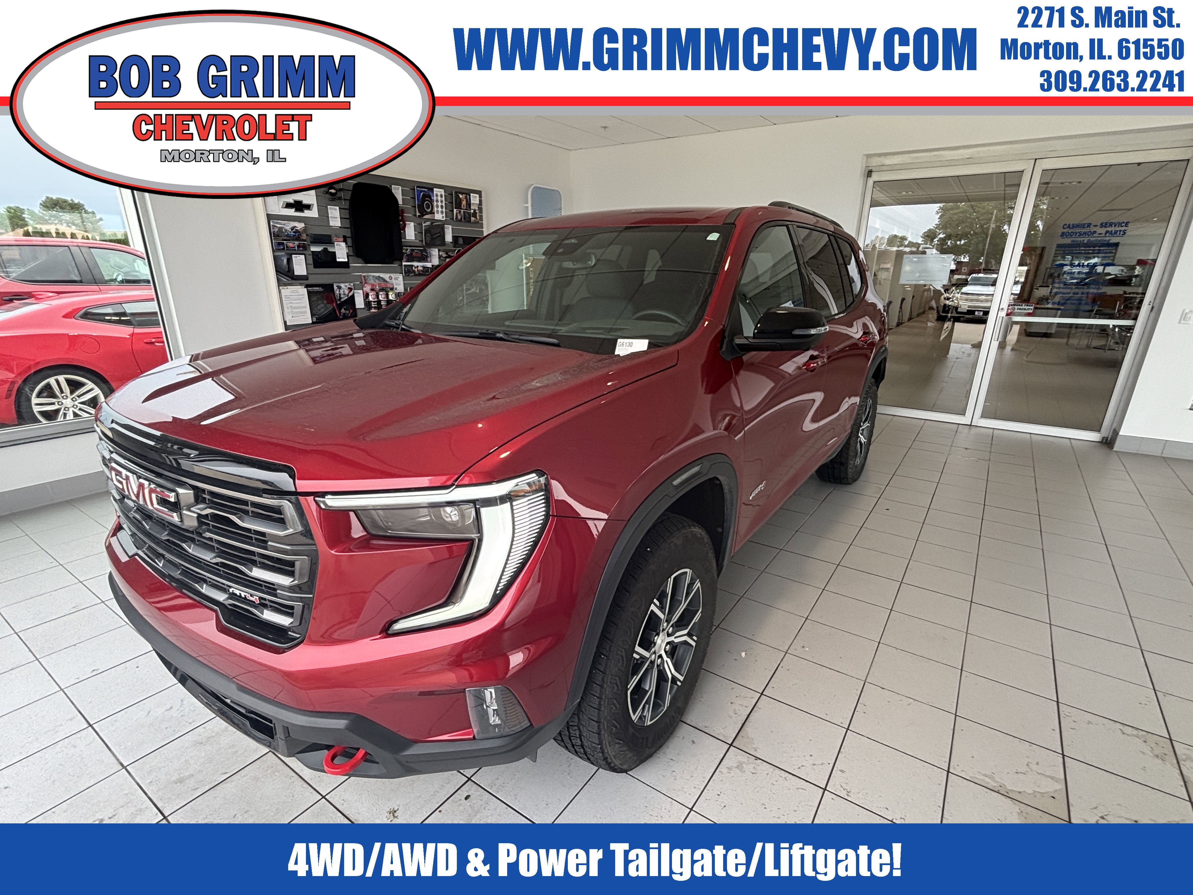 2025 GMC Acadia AT4 in Volcanic Red Tintcoat — front three-quarter view
