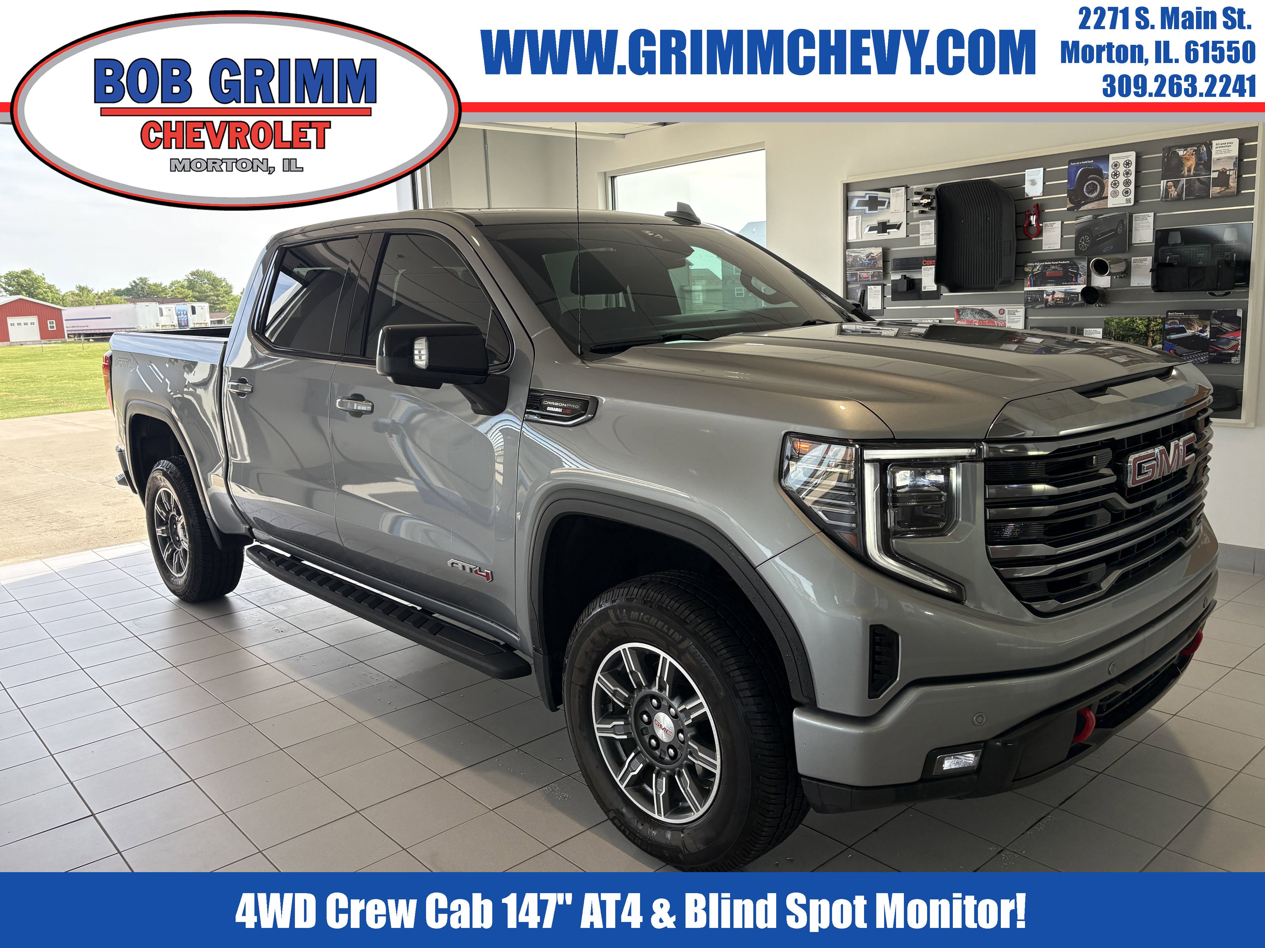 2024 GMC Sierra 1500 AT4 in Sterling Metallic — front three-quarter view